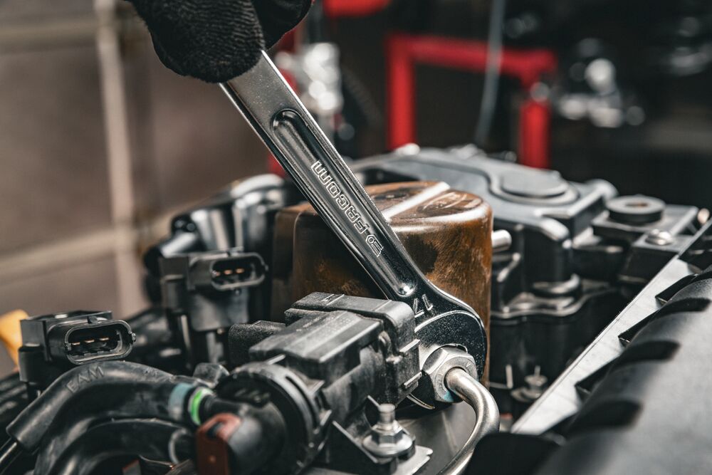 Grip long combination wrench in use Grip long combination wrench in use